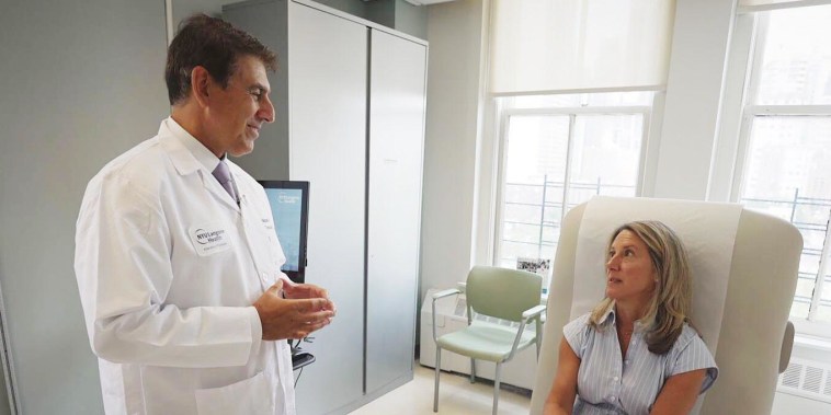 Katie Mohan talks with her doctor.