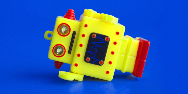 "Clanker" pronunciation and definition, with a robot toy lying on its side.