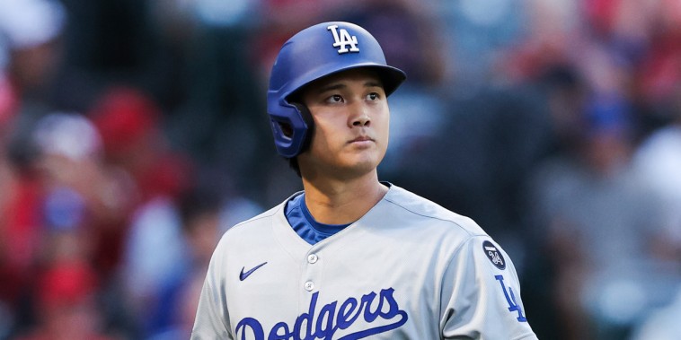 Shohei Ohtani walks on the baseball field