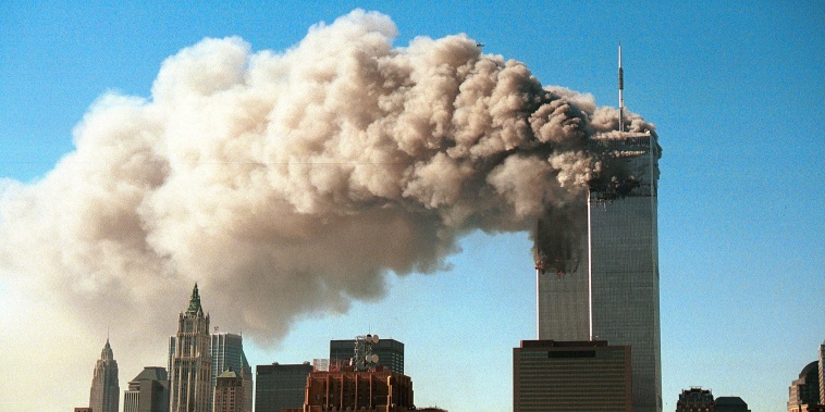 Image: Smoke pours from the twin towers of the World Trade Center after they were hit by two hijacked airliners in a terrorist attack Sept.11, 2001 in New York City.