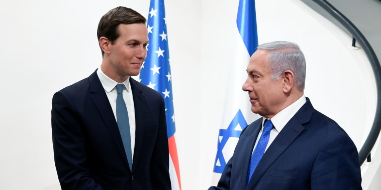 Benjamin Netanyahu, right, shakes hands with advisor Jared Kushner