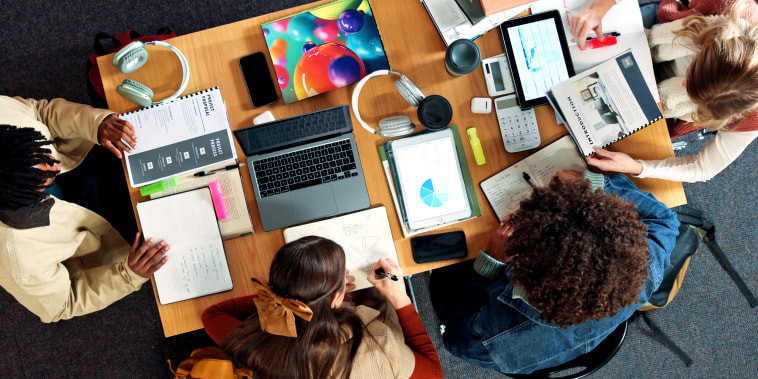 Above, study group and college with friends in library for research project, technology or legal stats. University, lawyer charts and case outcome probability with people on campus for digital course