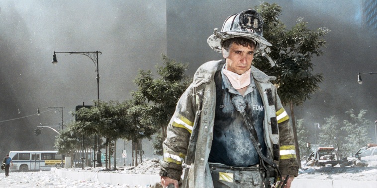 A New York City firefighter walks away from Ground Zero 