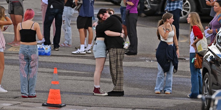 Students reunite with loved ones and classmates after a shooting at Evergreen High School 