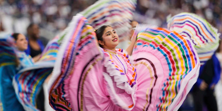 Dancers perform at an NFL halftime for Hispanic Heritage Month Sunday, Sept. 14, 2025, in Arlington, Texas. 