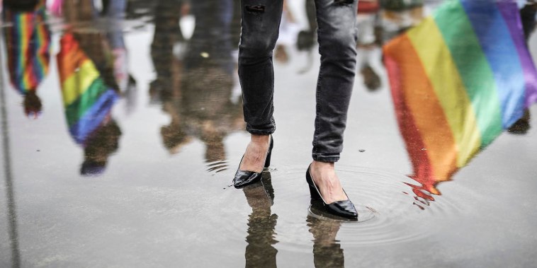 A man in heels marches in the Gay Pride parade in Bogota, Colombia, in 2023.
