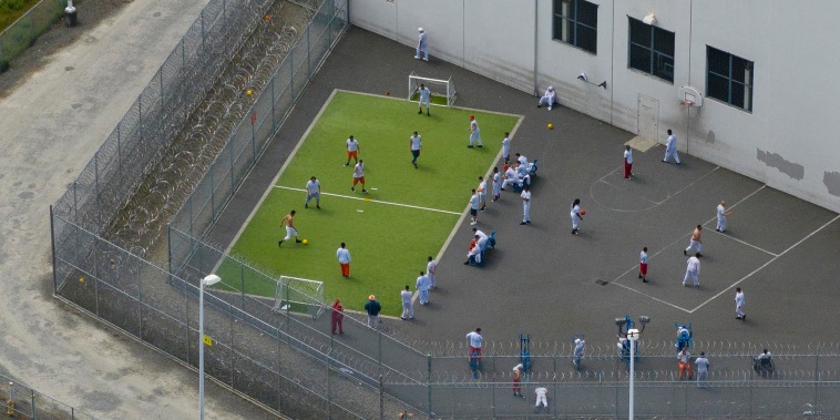 Detainees exercise in an outdoor recreation area at the Northwest ICE Processing Center on May 2, 2025 in Tacoma, Wash.