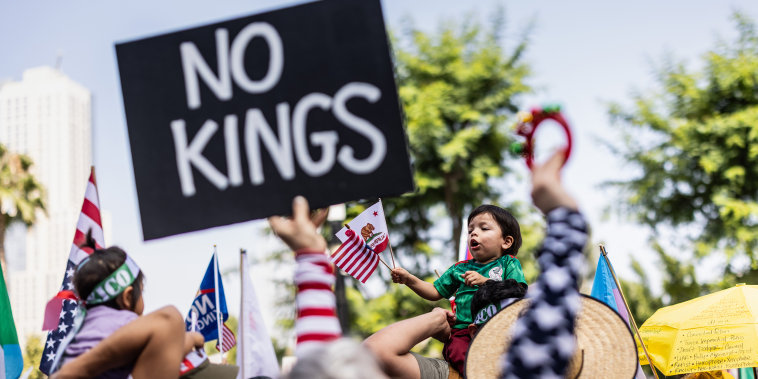 Protestors march during an anti-Trump "No Kings Day" demonstration.