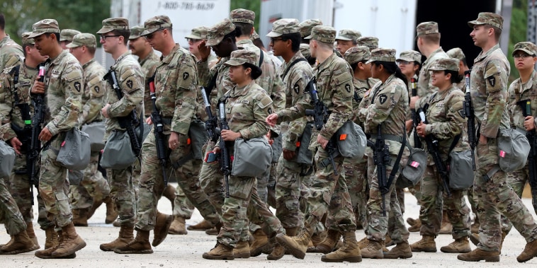 Members of the Texas National Guard assemble in Elwood, Ill.,