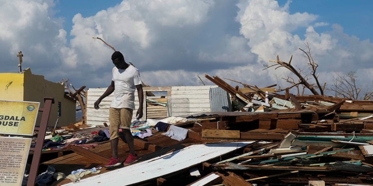 A man looks for salvageable items in the aftermath of Hurricane Melissa in Black River, Jamaica, Thursday, Oct. 30, 2025.