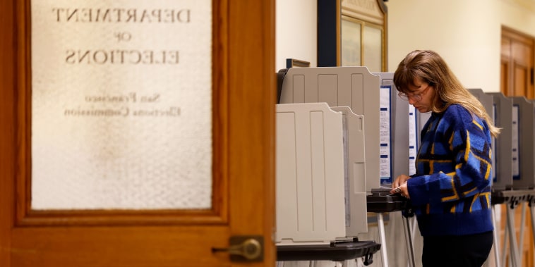 A voter fills out their ballot inside San Francisco City Hall.