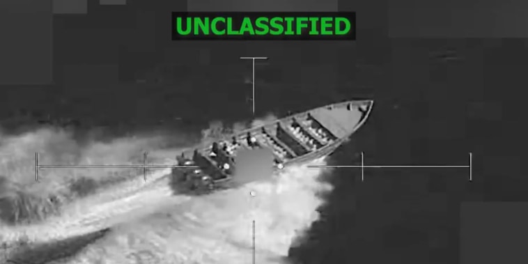 A black and white video still of a target on a boat