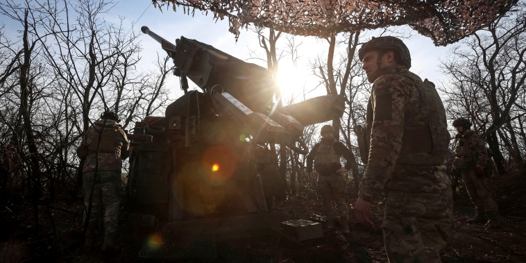 Ukrainian servicemen prepare to fire a self-propelled howitzer towards Russian troopsn near the front line town of Pokrovsk