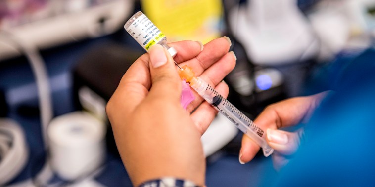 Image:A medical assistant fills a needle with Gardasil, an HPV vaccination, in Texas in 2016.