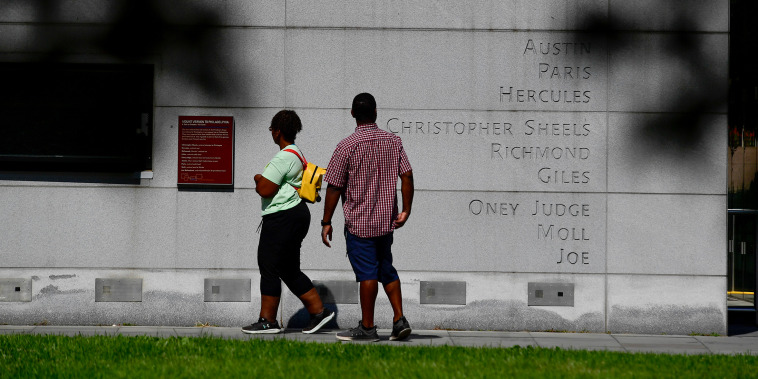 The names of enslaved people who lived in the President's House are carved into a monument in Independence National Park on August 9, 2025 in Philadelphia, Pennsylvania. 