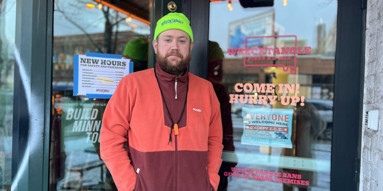 Jeff Rogers stands in front of the doorway to Wrecktangle Pizza