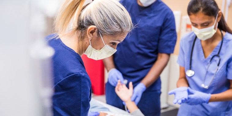 Doctors talking to the patient