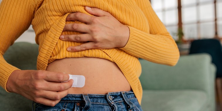 Female Applying HRT Patch for Hormonal Balance