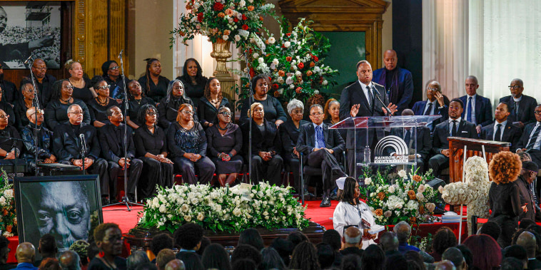 Mourners at funeral.