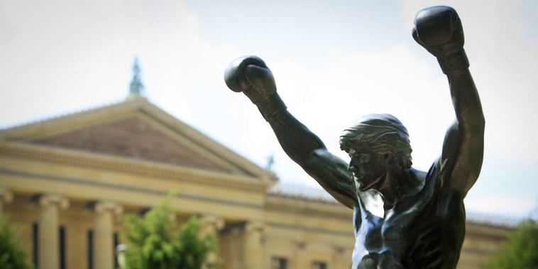 The bronze statue of Sylvester Stallone portraying the boxer from the film "Rocky" near the steps of the Philadelphia Museum of Art.