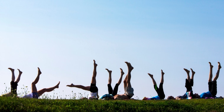 Yoga students point their toes skyward during a weekly session at Kettle Cove. The donation-based classes are held on Fridays at 8 a.m. The donations are split between Kettle Cove State Park and South Portland-based nonprofit group Cultivating Balance, teacher Melora Gregory said.