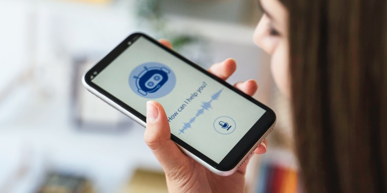 A close-up view of a person using a smartphone voice assistant feature