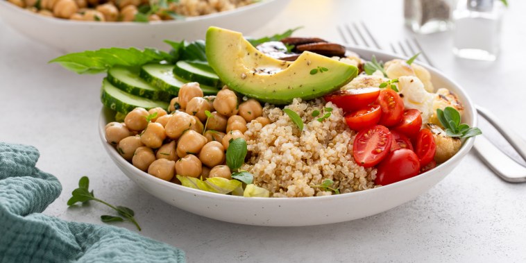 Healthy high protein vegan plant based lunch bowl with mushrooms, roasted cauliflower, chickpeas and quinoa