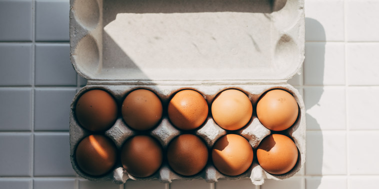 Close up of open carton of fresh store bought white eggs