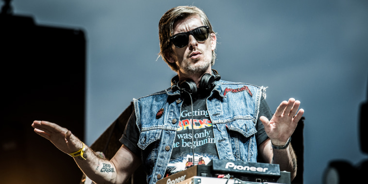 Kavinsky dances at a DJ Booth