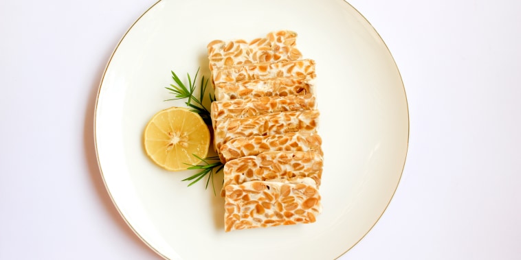 Tempeh slices on a white background