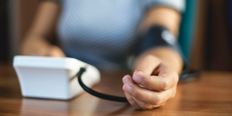 Woman checking blood pressure