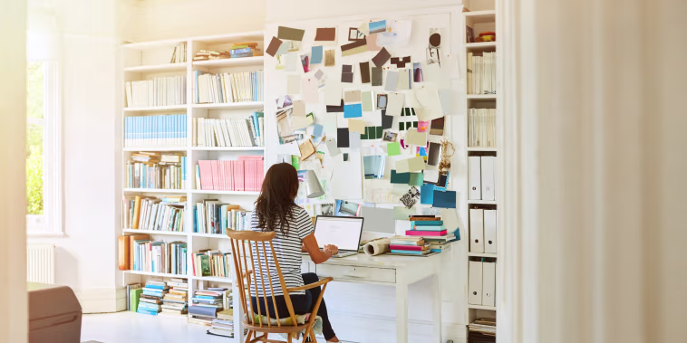 Image: A woman works at home