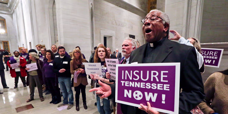 Protesters calling for the passage of Gov. Bill Haslam's Medicaid expansion proposal demonstrate outside the House chamber before Haslam delivers his State of the State address Feb. 1, 2016, in Nashville, Tennessee.