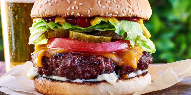 If you press a little dimple into the center of each patty, that will keep the burgers from puffing up in the center, so you have a flatter surface for all your favorite toppings.