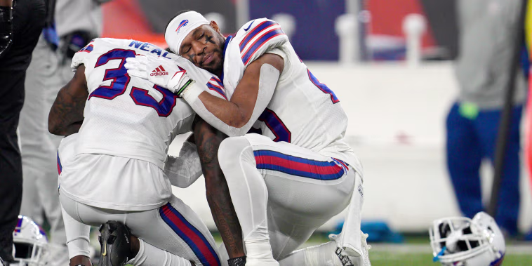 Buffalo Bills' Siran Neal (33) and Nyheim Hines react after teammate Damar Hamlin was injured during the first half of an NFL football game against the Cincinnati Bengals, Monday, Jan. 2, 2023, in Cincinnati.