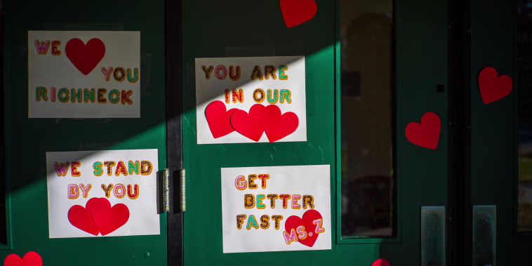 Messages of support for teacher Abby Zwerner grace the front door of Richneck Elementary School in Newport News, Va.