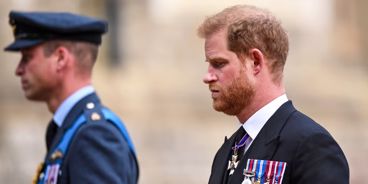 Prince William, Prince of Wales and Prince Harry, Duke of Sussex join the Procession following the State Hearse carrying the coffin of Queen Elizabeth II towards St George's Chapel on Sept. 19, 2022 in Windsor, England.
