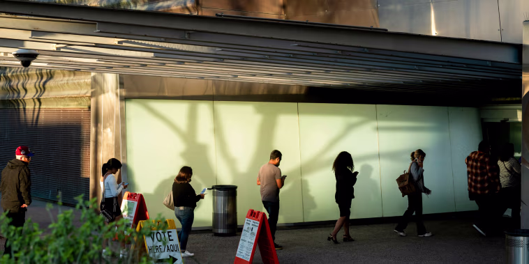 Voters wait in line at a polling location for the 2024 Presidential election.
