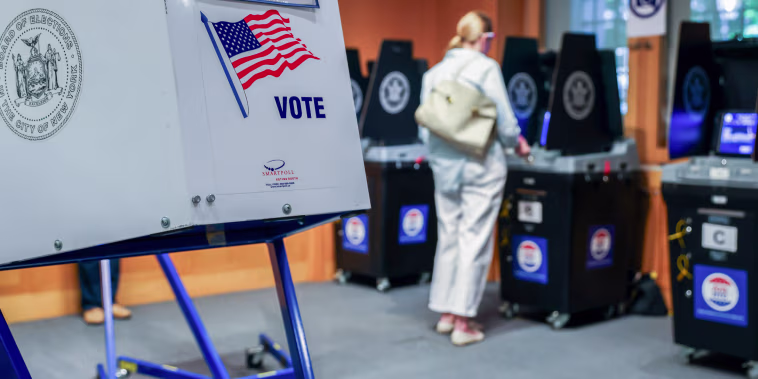 A voting booth as a voter scans their ballot in New York.