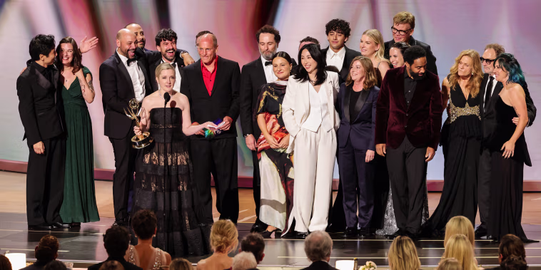 Katie Dippold and cast/crew accept an Emmy Award.