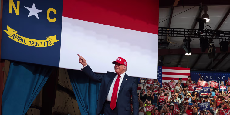 U.S. President Donald Trump greets supporters.