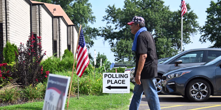 A voter arrives at a polling place on primary election day on Aug. 4, 2026, in St. Louis.