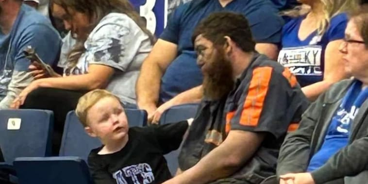 Photo of a coal miner dad covered in soot with his son at basketball game went viral. Where are they now?