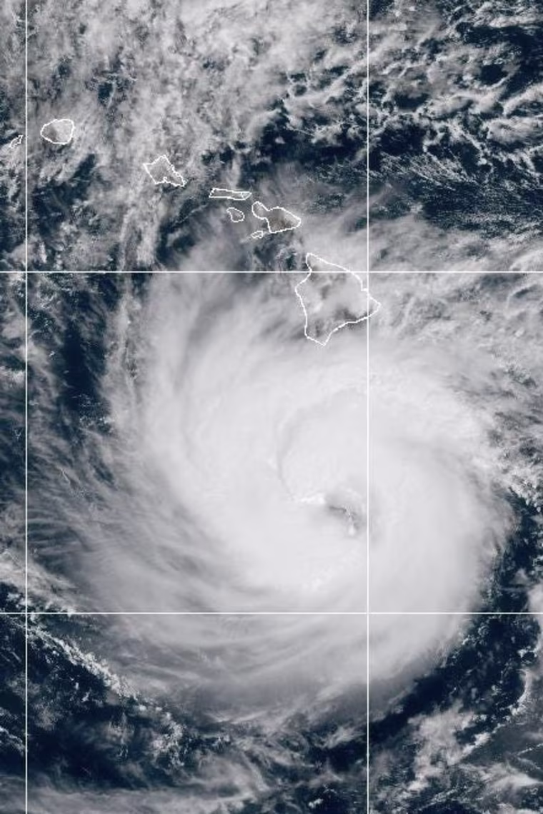 A color satellite image of a hurricane swirling in the Pacific Ocean.