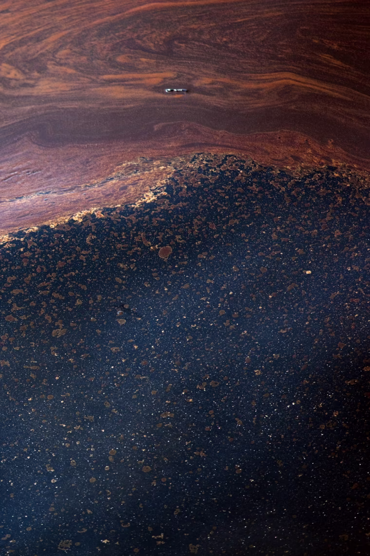 Pools of crude oil float on the surface of Gulf of Mexico waters.