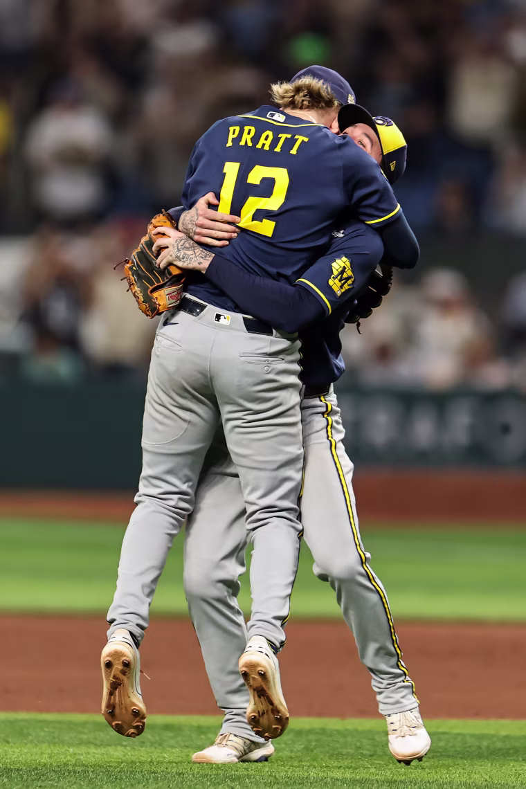 Cooper Pratt #12 and Brice Turang #2 of the Milwaukee Brewers