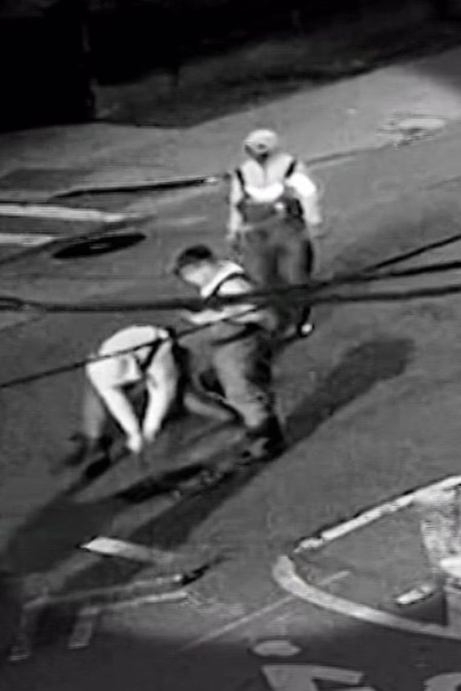 New video shows a group wearing hip waiters and carrying flash lights as they pry open a manhole cover on May 5th just before 2 a.m. in Astoria.