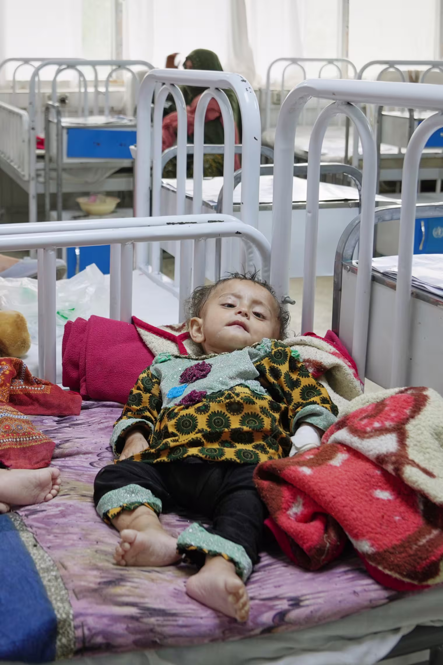 Women care for their children in the malnutrition ward at Indira Gandhi children's hospital in Kabul, Afghanistan, Monday, Oct. 12, 2026.