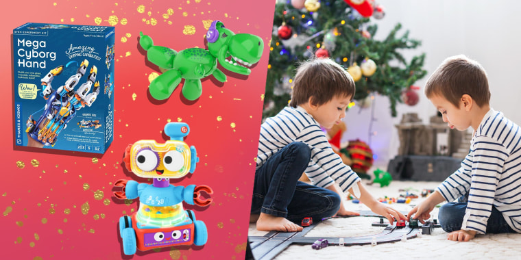 Two adorable boys, playing with toys on Christmas and three different types of toys