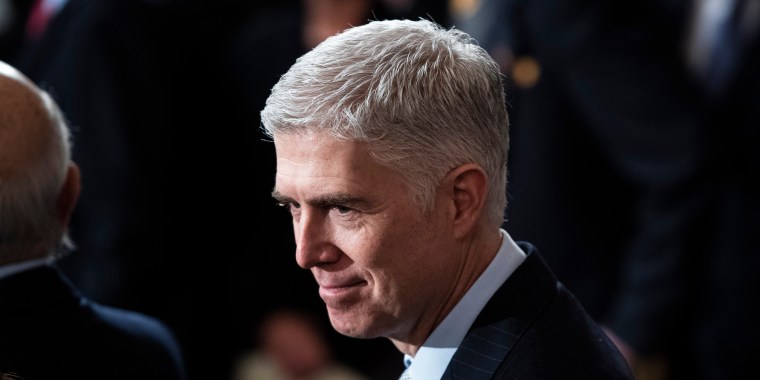 Supreme Court Associate Justice Neil M. Gorsuch waits for the arrival of former President George H.W. Bush at the Capitol Rotunda on Dec. 3, 2018, in Washington.